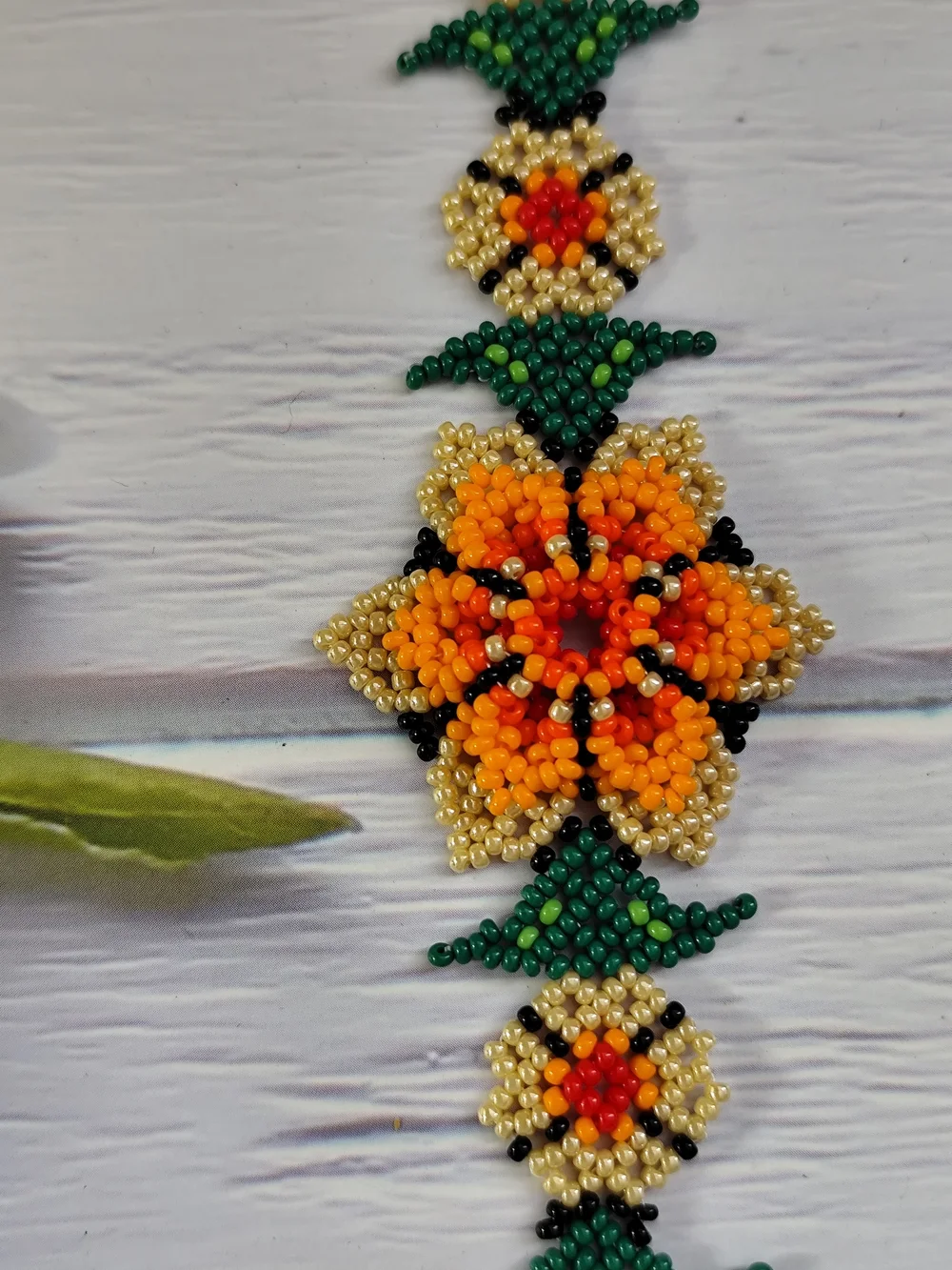 Vibrant Orange Floral Seed Bead Bracelet with Gold & Green Accents